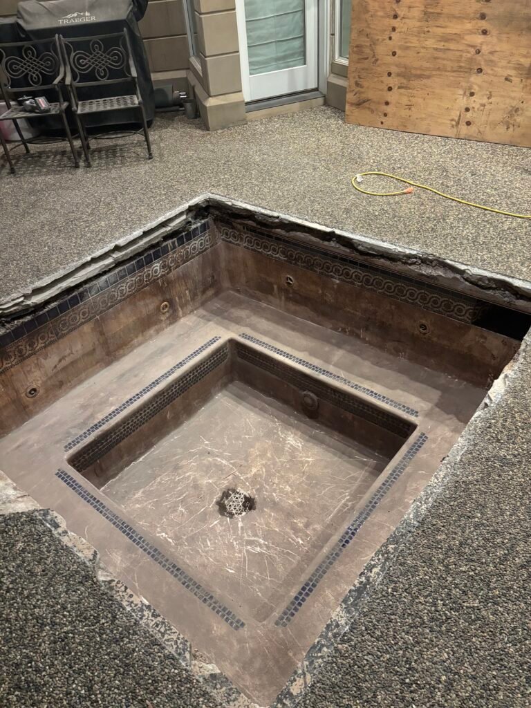 Empty hot tub basin awaiting repair