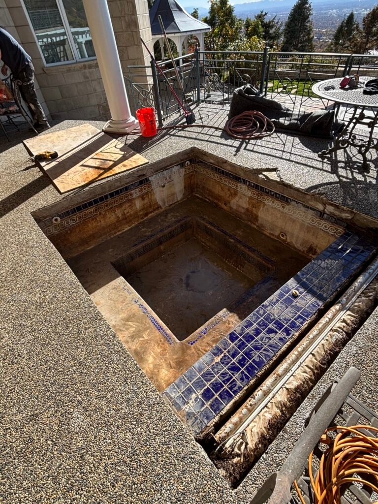 Empty tiled outdoor spa under repair