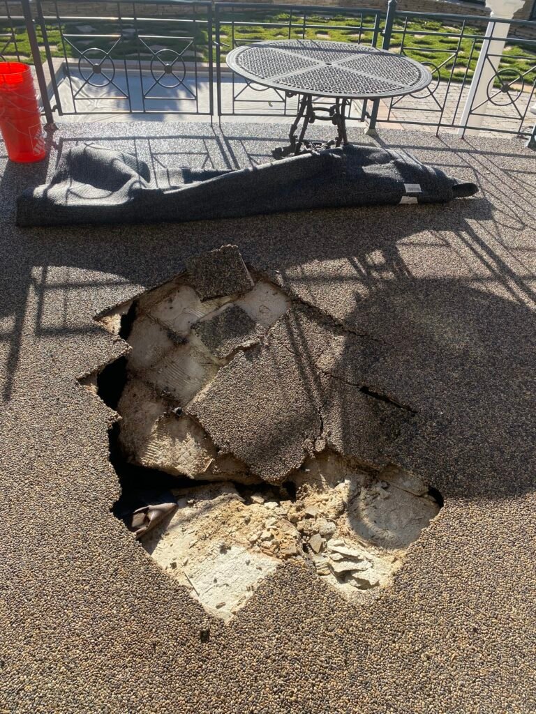 Hole in concrete deck showing sub-layers.